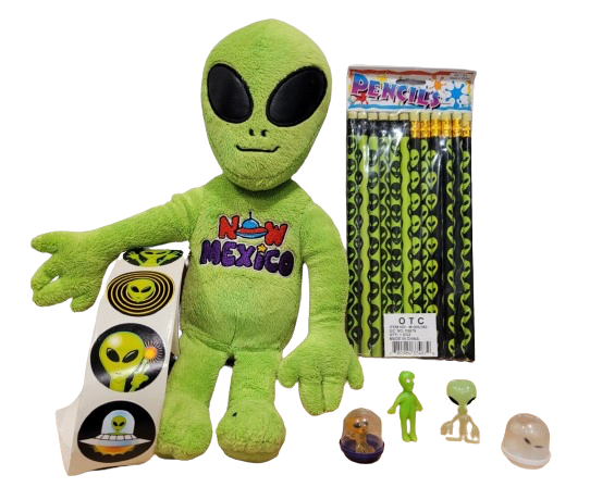 An image of an alien plushie surrounded by other alien paraphernalia.